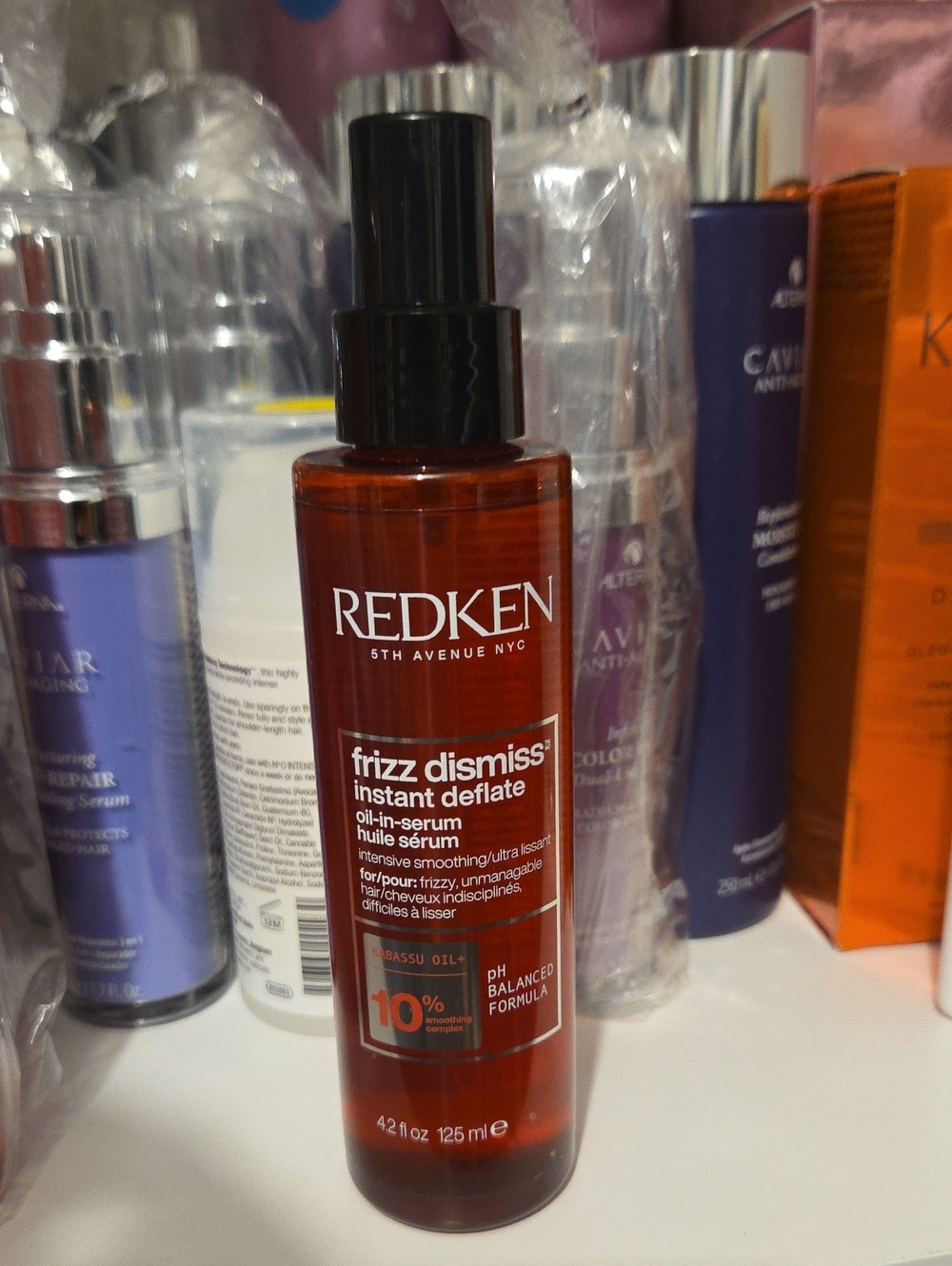 Redken Frizz Dismiss Instant Deflate Oil-In-Serum — amber red bottle